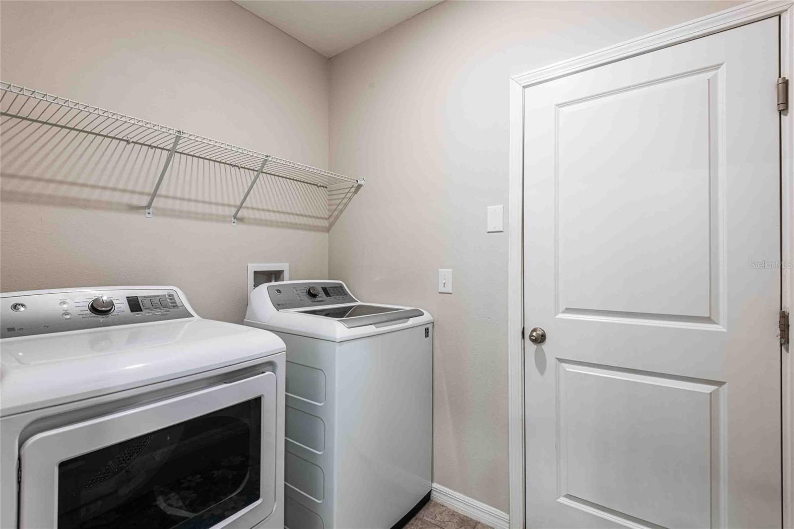 Laundry room leads to garage.