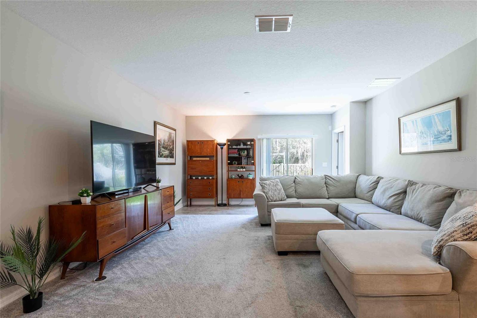 The great room includes a ceiling fan and a light fixture hookup.