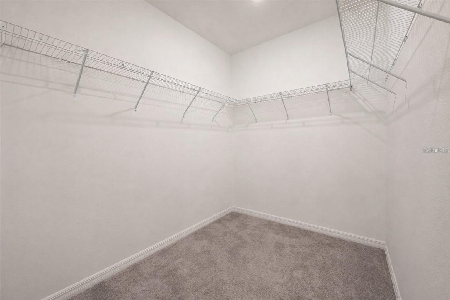 Primary walk-in closet.