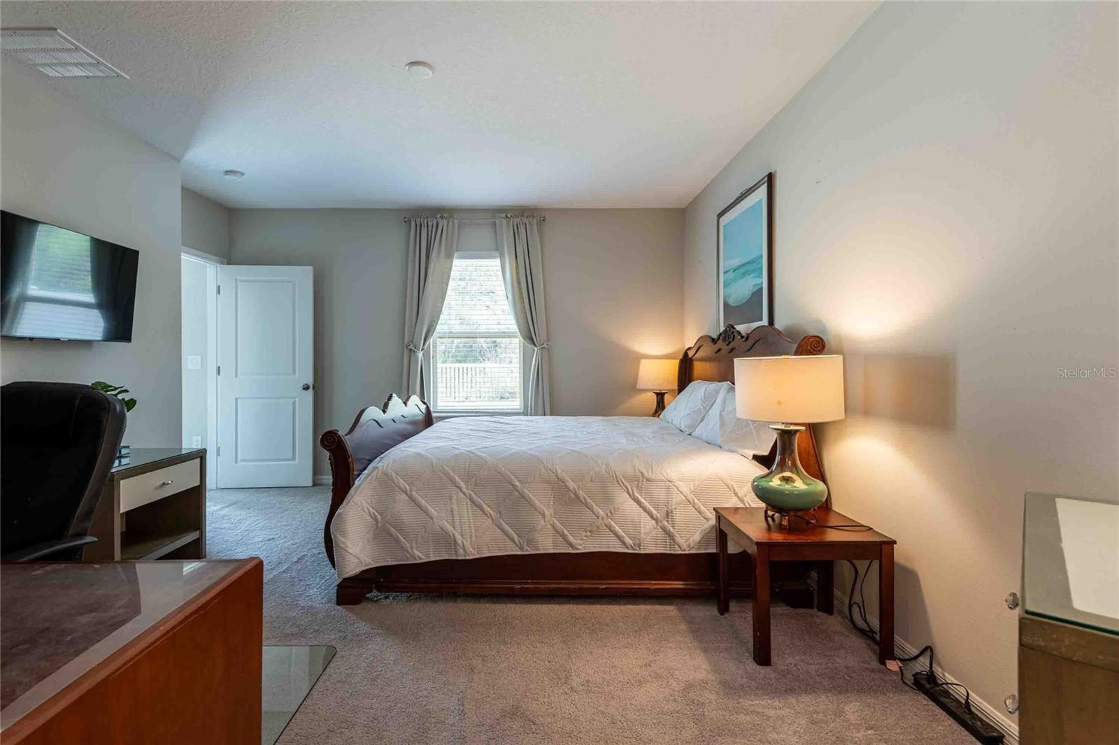 Another view of the primary bedroom.