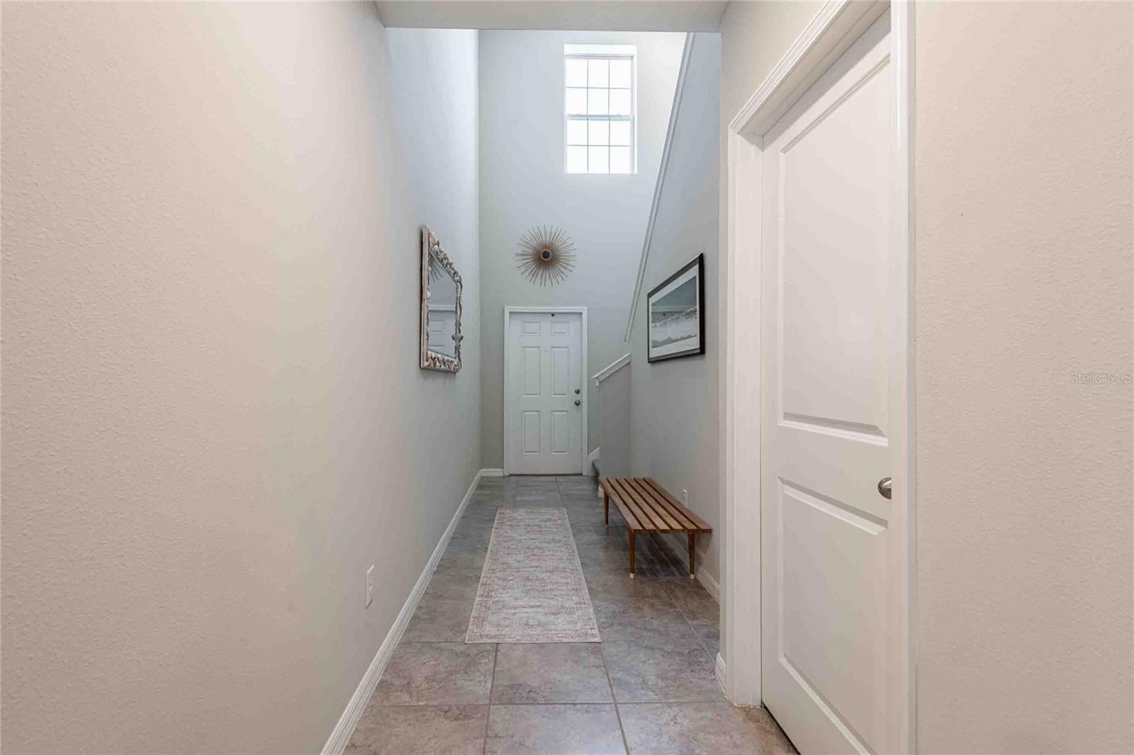 Half bath located off the foyer.