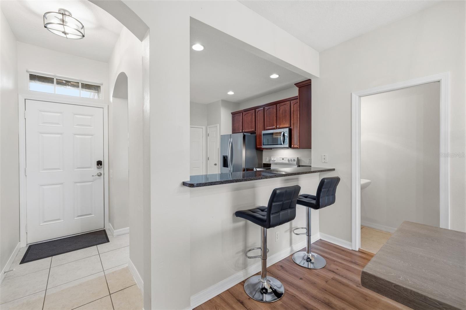 BAR TOP LOOKING INTO KITCHEN