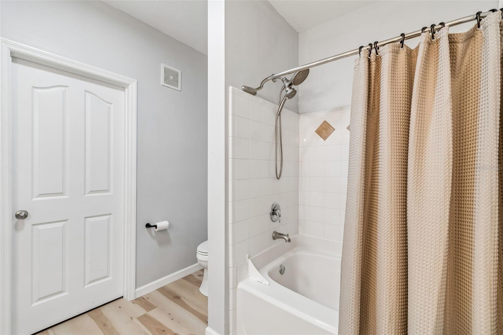Main bathroom features a generous walk-in closet