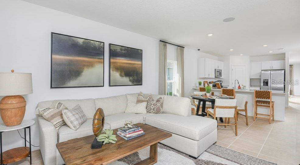 Family room, casual dining, and kitchen (builder's photo)