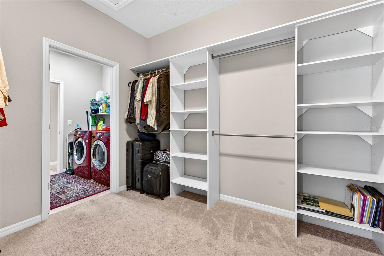Custom organizer in walk-in primary closet
