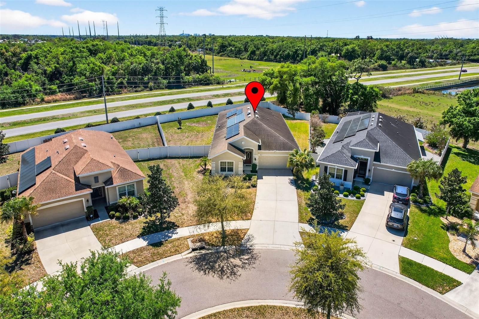 View of Solar Panels and Large Lot