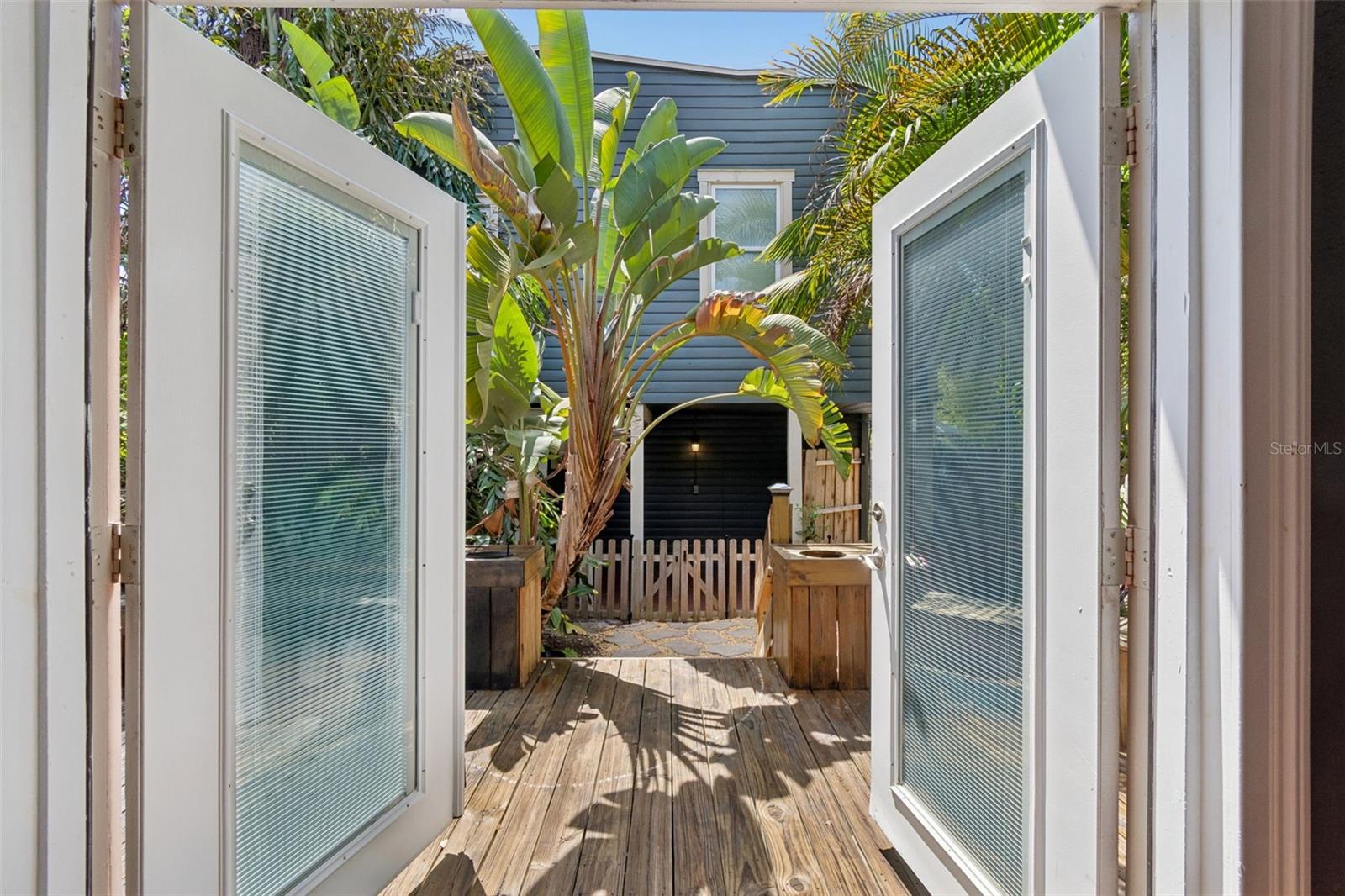 French doors leading to back deck and apartments