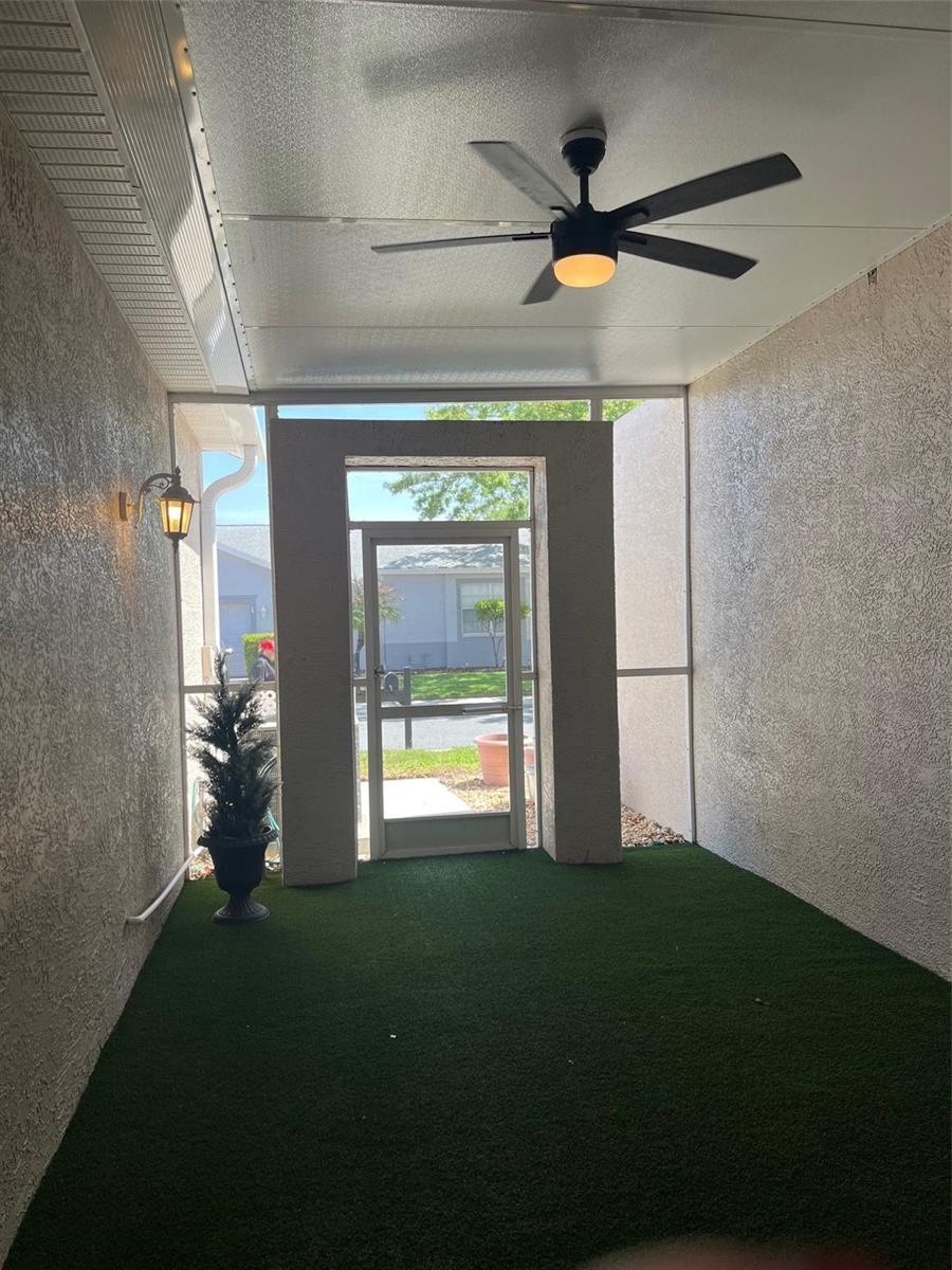 ENCLOSED ENTRYWAY WITH VIEW OF ENTRANCE