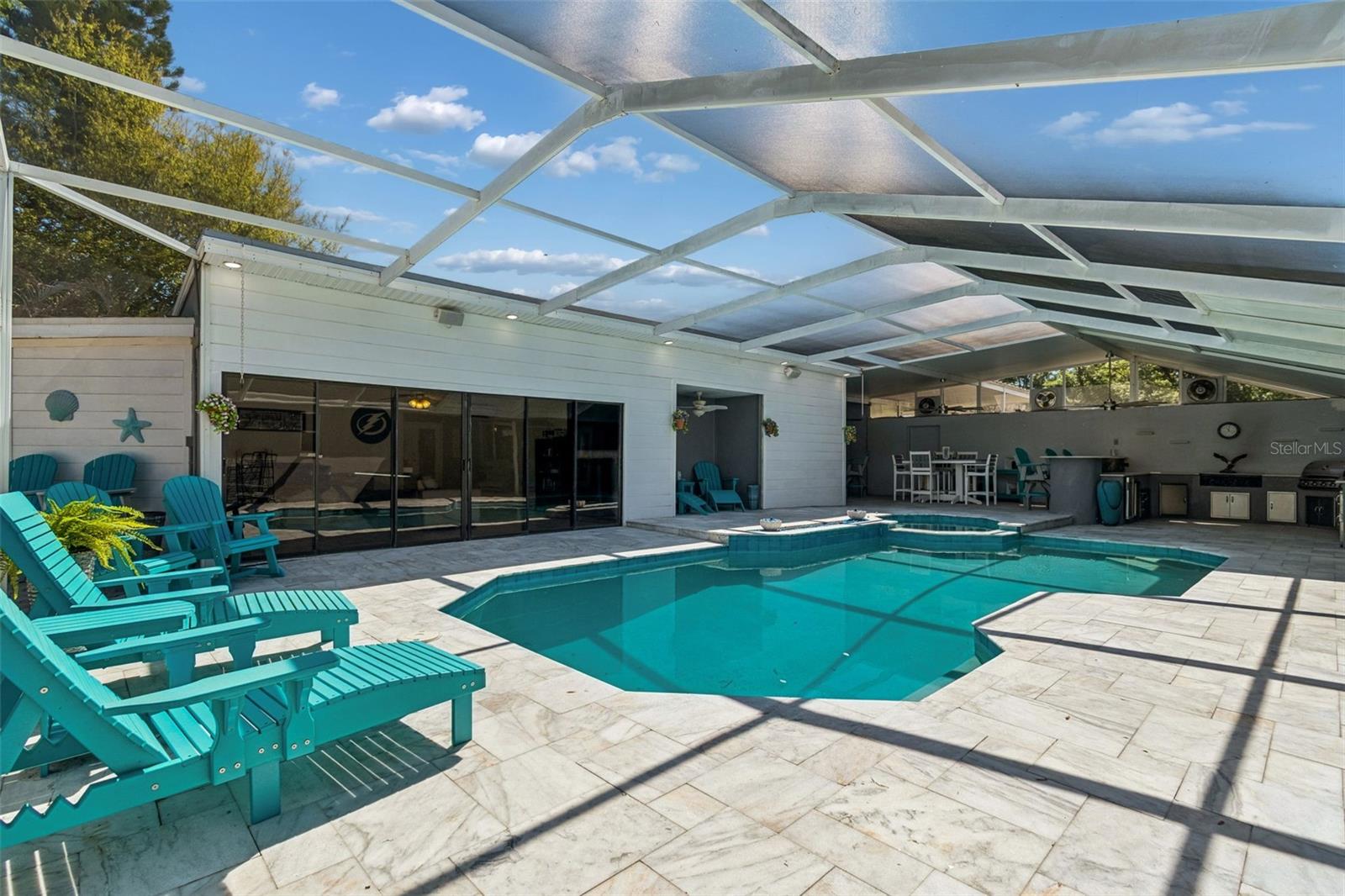 Flex Space...additional square footage(26'x16' not included in home footage) to be used as a game room, party room, man cave, or whatever your heart desires. A split air unit keeps this room nice and cool. Accessible through another door is the entrance into a storage room(the size of a 1-car garage).