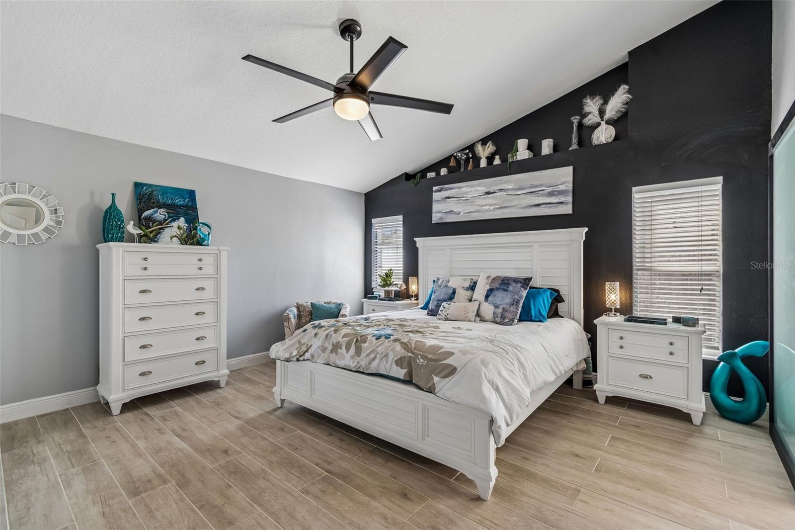 Vaulted ceiling adds to the spaciousness of this primary bedroom with it's ensuite bath!