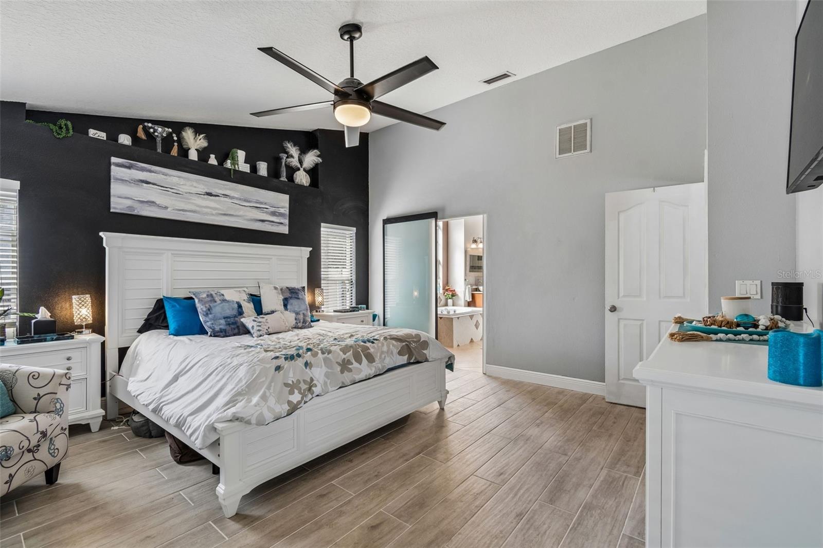 Sliding door opens to reveal the ensuite bath.