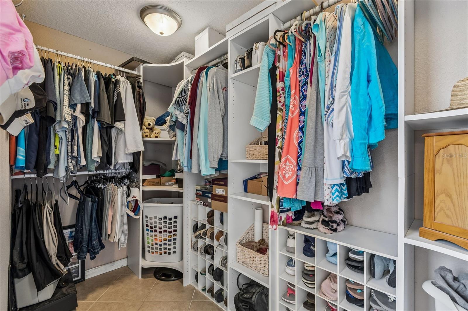 Custom organization in the primary walk-in closet.