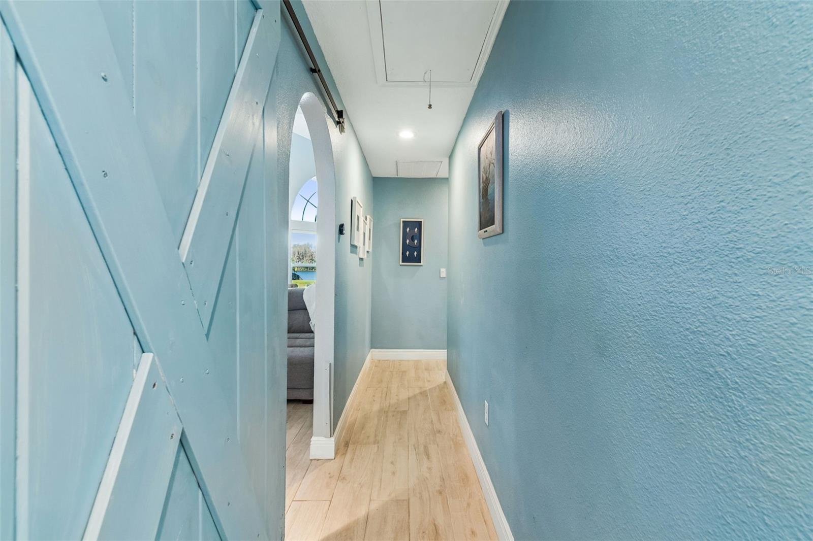 Sliding barn door closes the secondary bedroom wing off to the remainder of the home for guest's privacy!