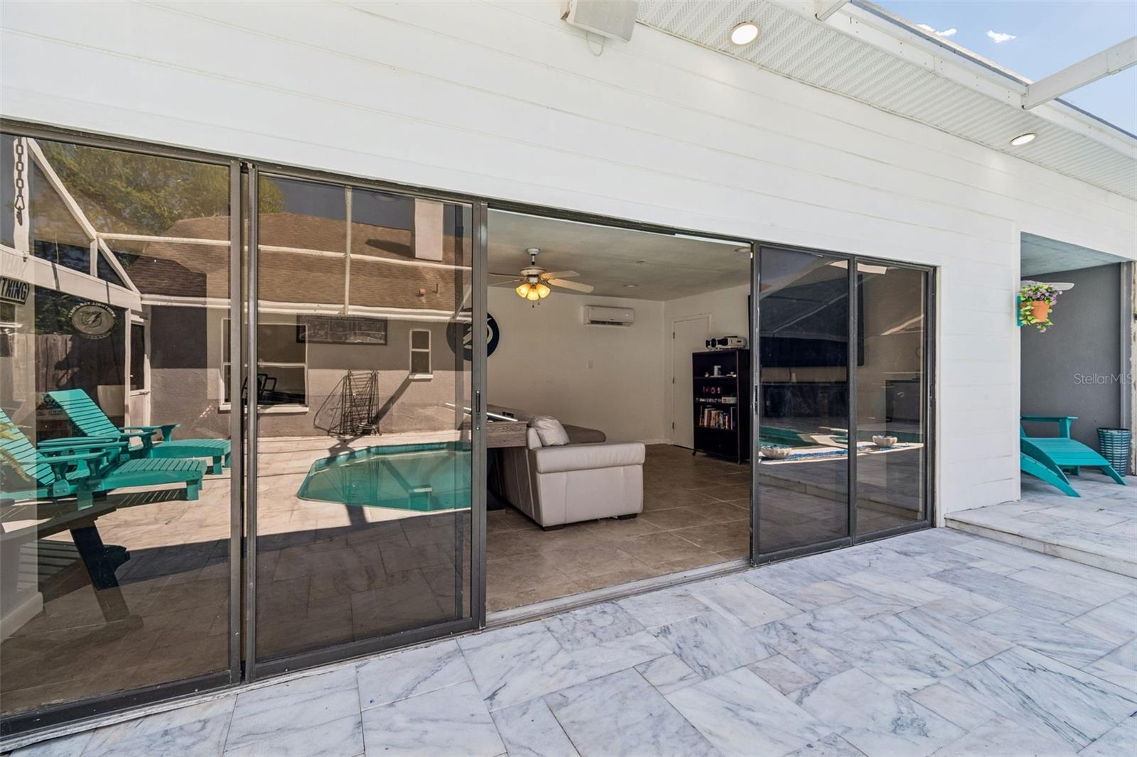 Flex space opens up onto pool area to extend the entertaining area!