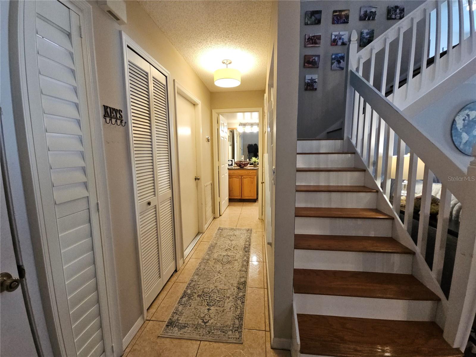 Hallway to 1/2 BathWooden Staircase