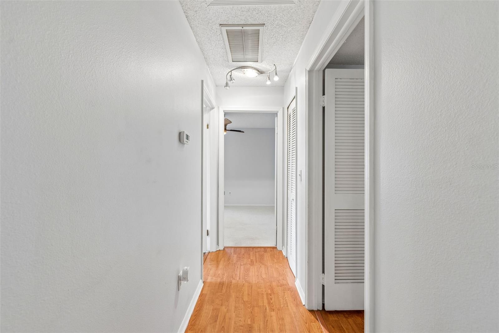 Hallway to other 2 bedrooms