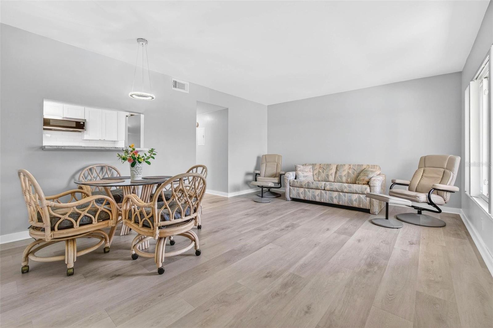 Living Dining combo w/luxury vinyl plank through out