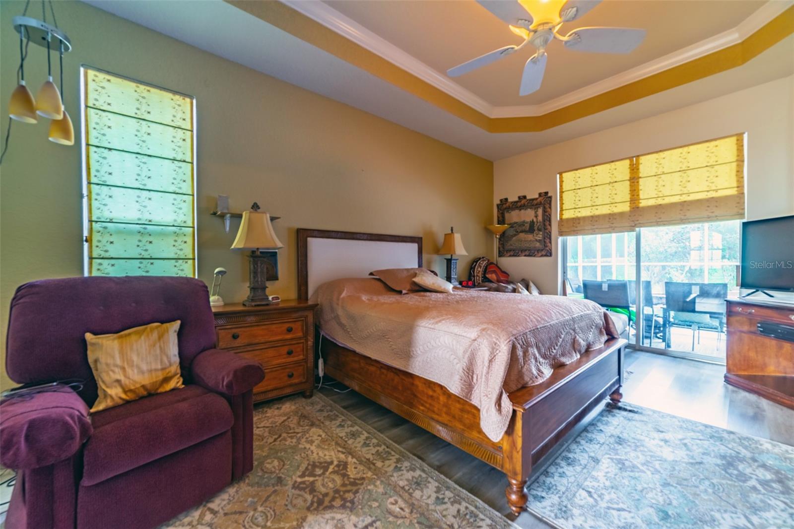 Master Bedroom with Sliding Doors to outside Patio & Pool