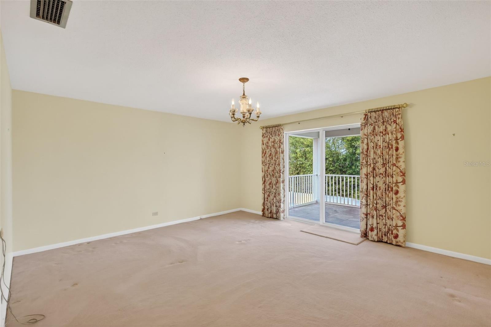 Bedroom 3 with sliders out to private balcony