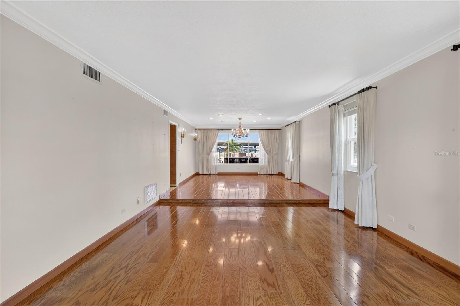 As you enter the living room and raised dining area, which are large and welcoming.