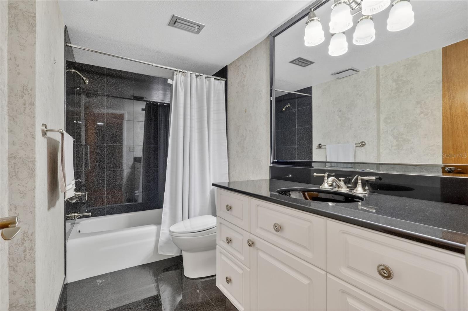 The first floor bath is large and has a tub/shower combo.