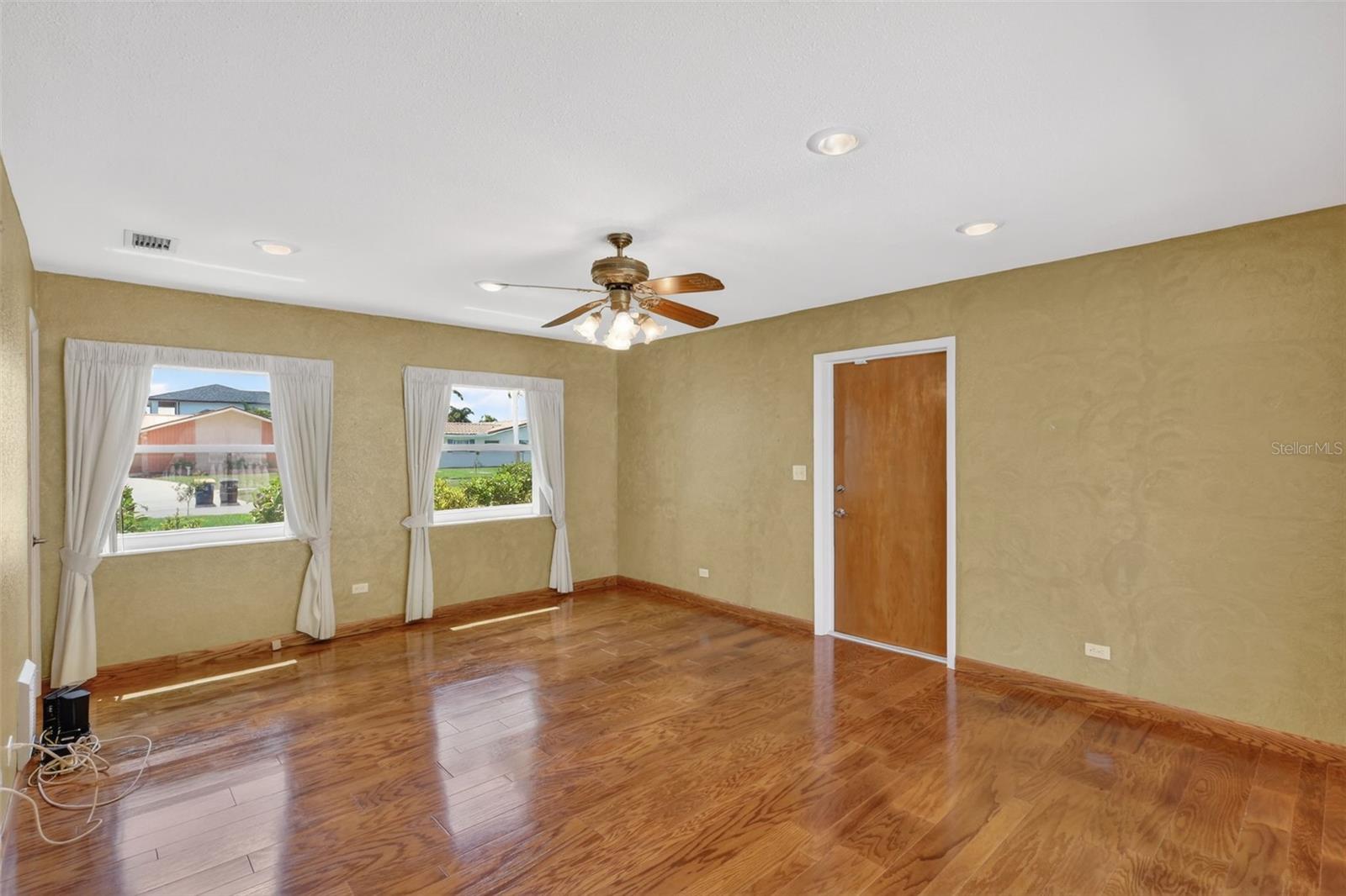 Den/Study is off the kitchen and leads to the garage