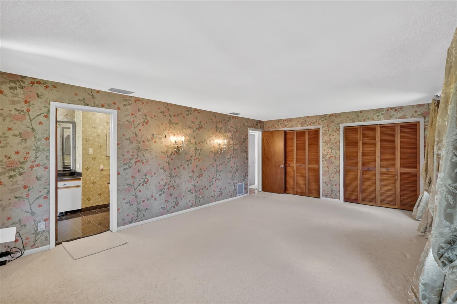 Primary bedroom with 2 large built in closets and En-Suite bath.