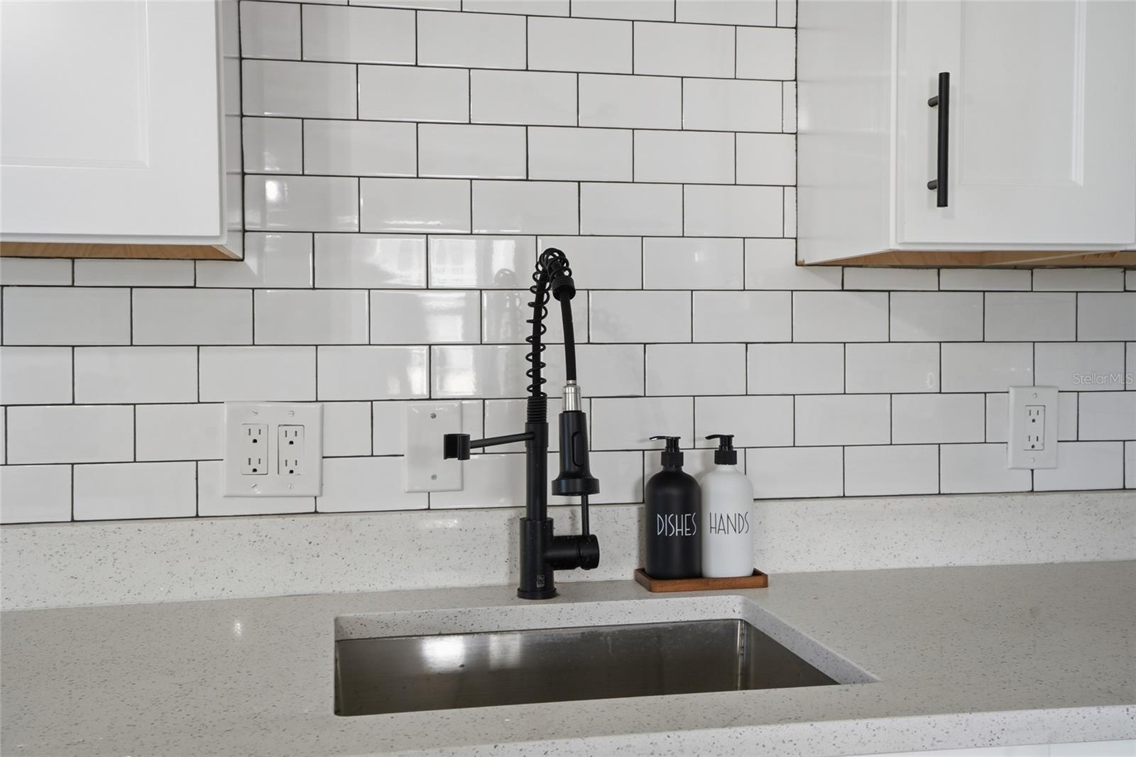upgraded faucet and sink with beautiful Quartz counterttops