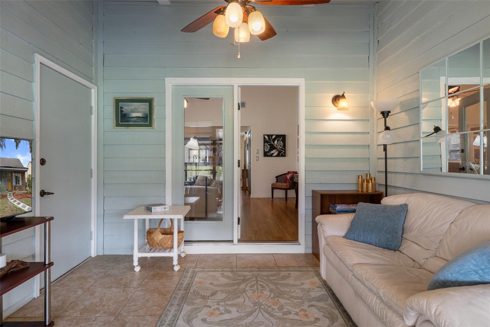 Cozy Florida room with access to the cart barn