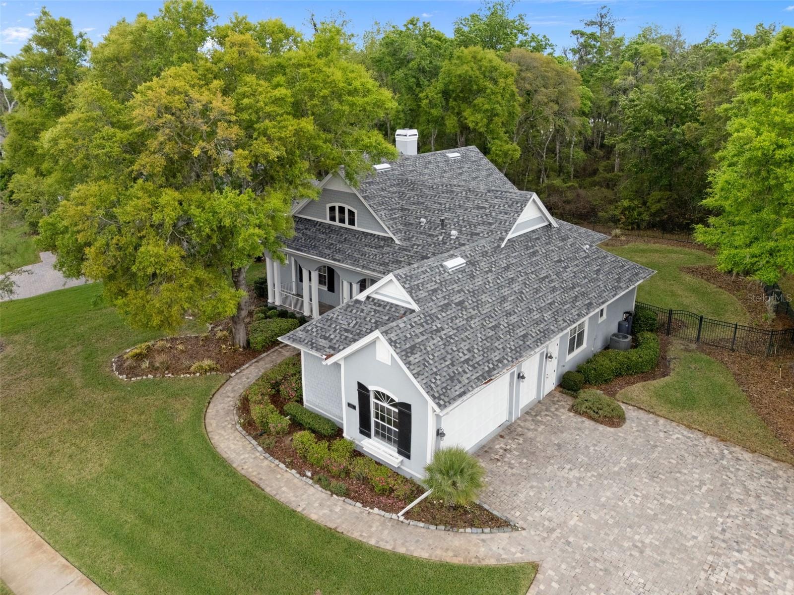 6096 Dusk Rose Lane with Side Entry Garage and Brick Paver Driveway