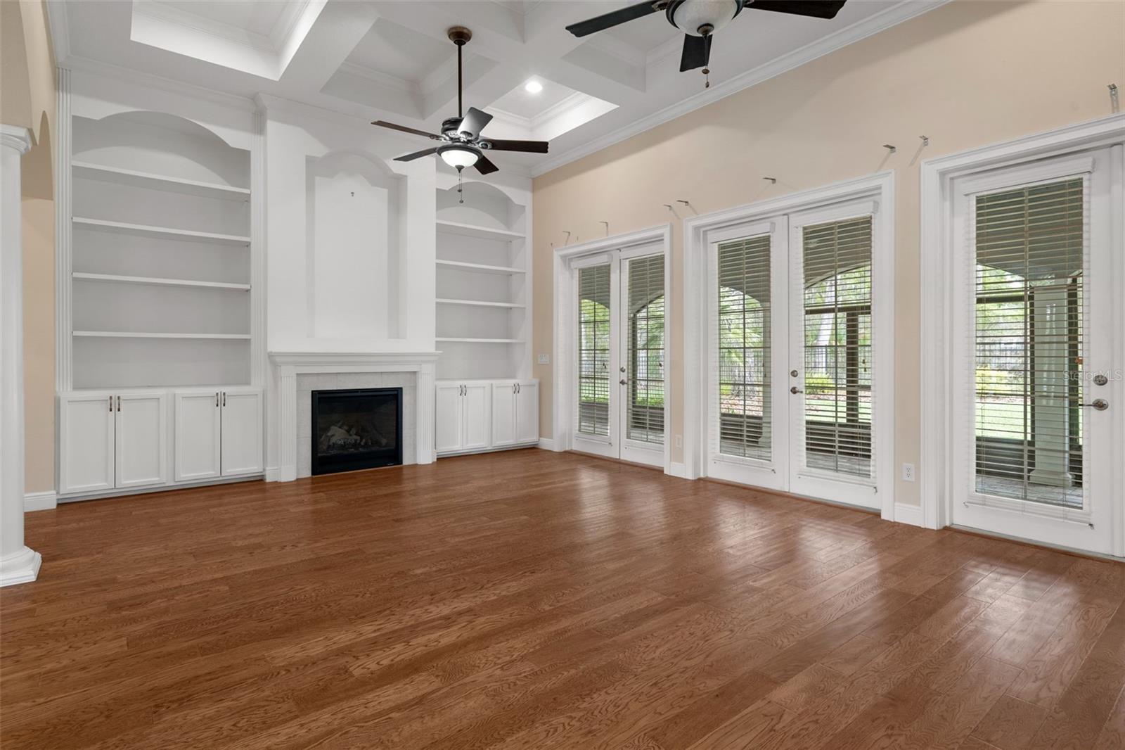 Living Room with Coffered Ceiling and Beautiful Built-In Cabinetry