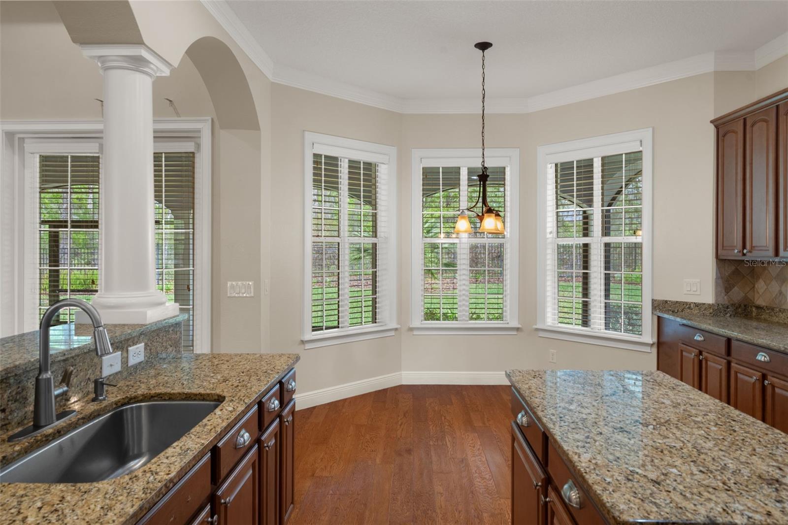 Kitchen with Granite Tops and Hardwood Floors