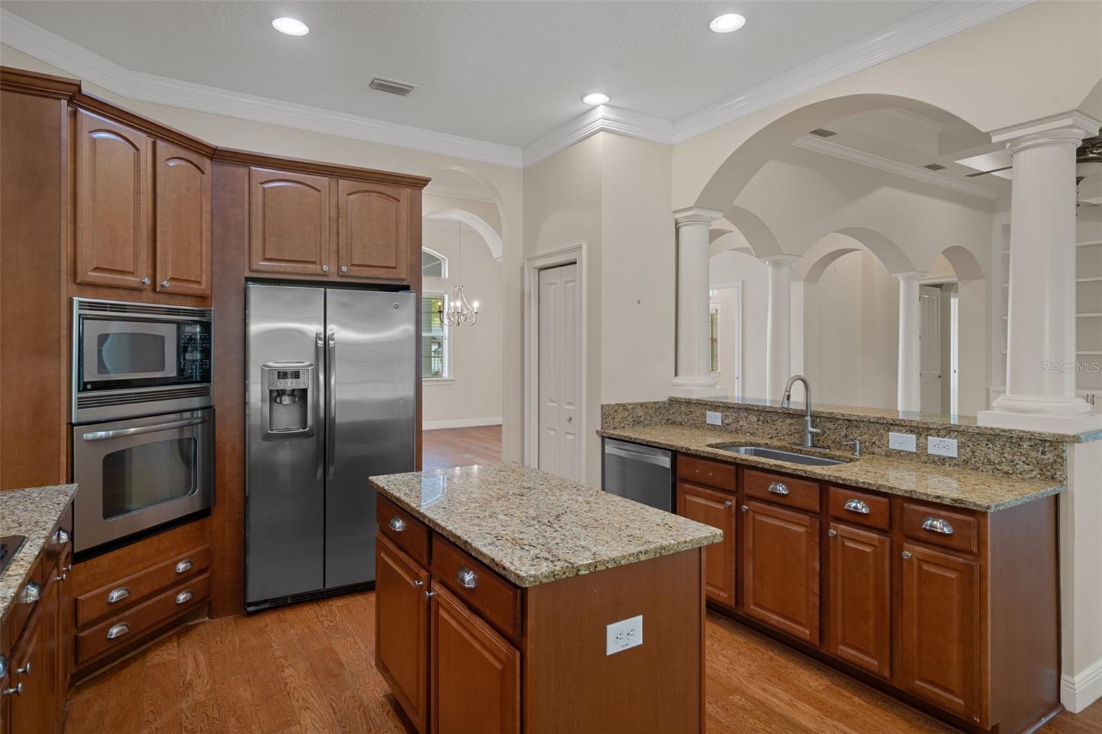 Kitchen with Hardwood Floors Overlooking Living Room