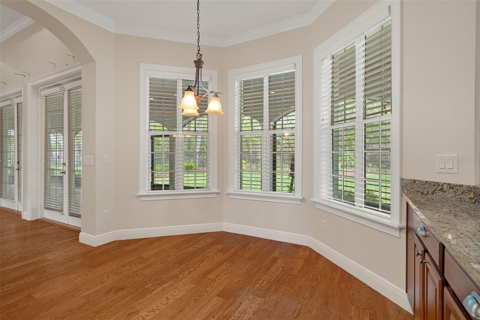 Breakfast Nook with Bay Window and Hardwood Floors