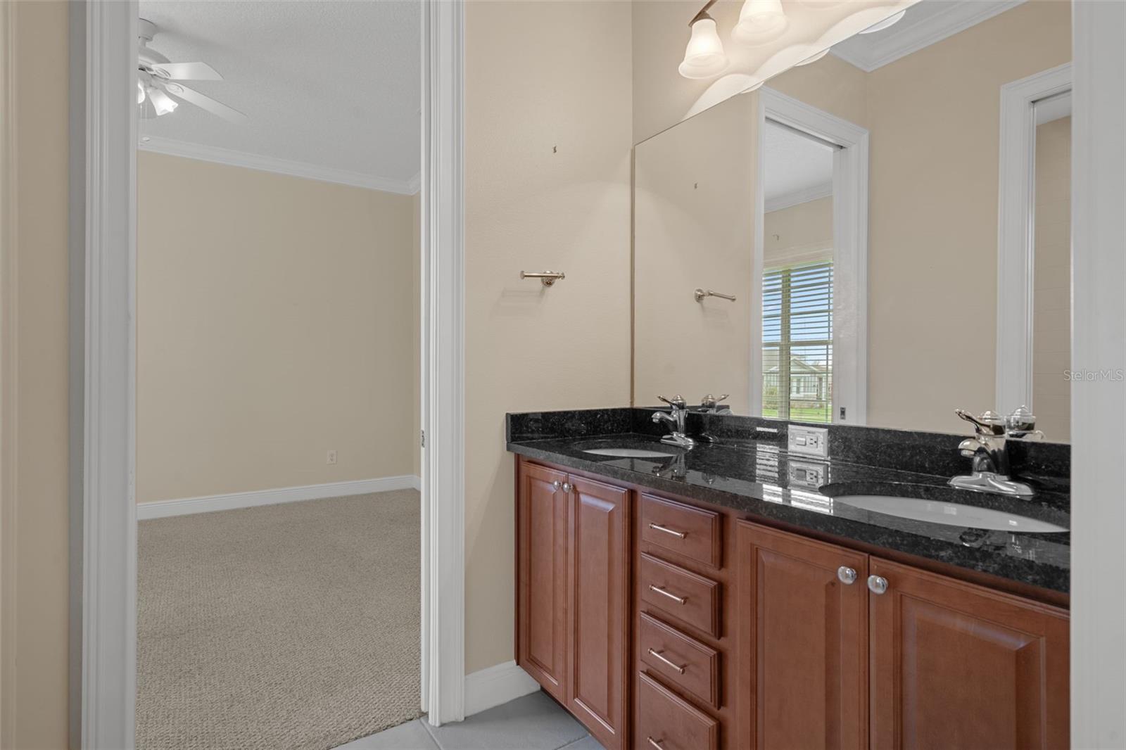 Jack and Jill Bathroom with Granite Vanity and Double Sinks