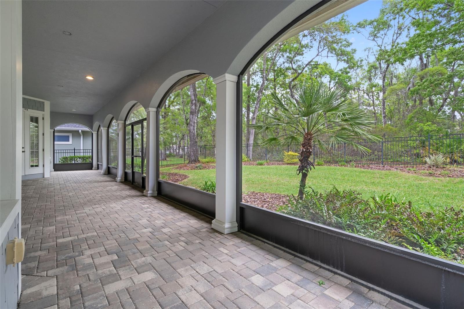 Screened Rear Lanai with Brick Pavers and Beautiful Architecture