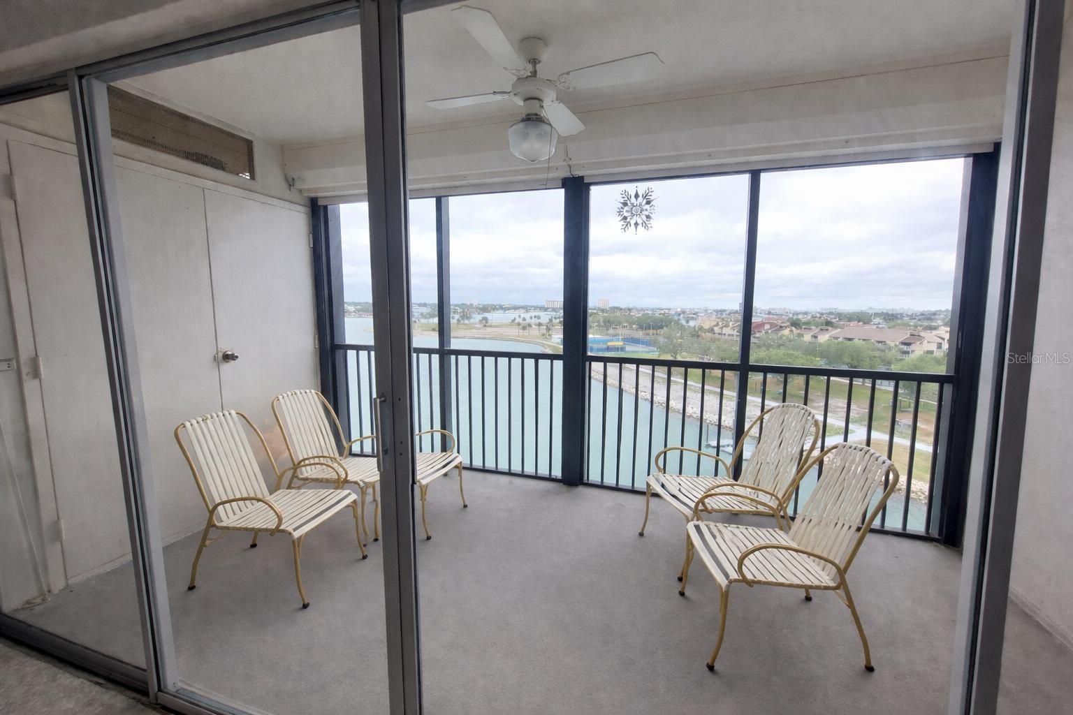 Screened balcony with electric hurricane shutters