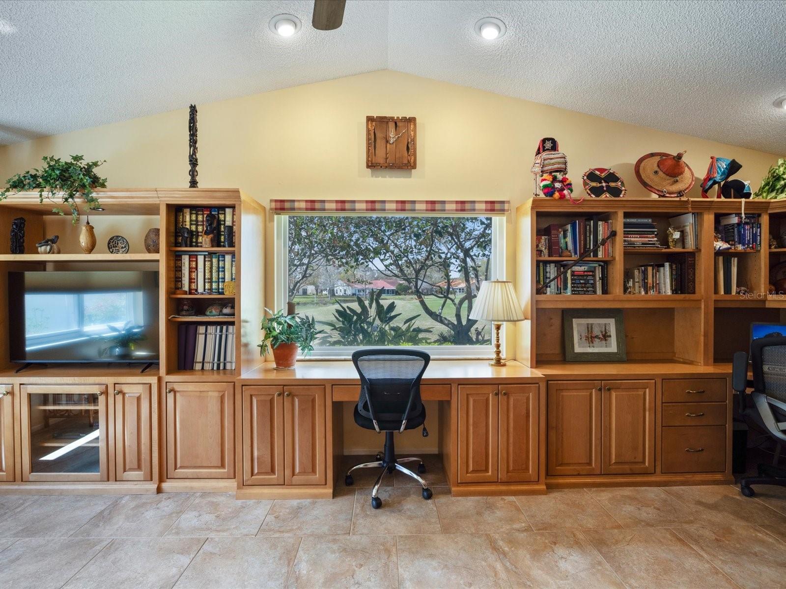 Large family room window looking directly out to golf course and pond views!