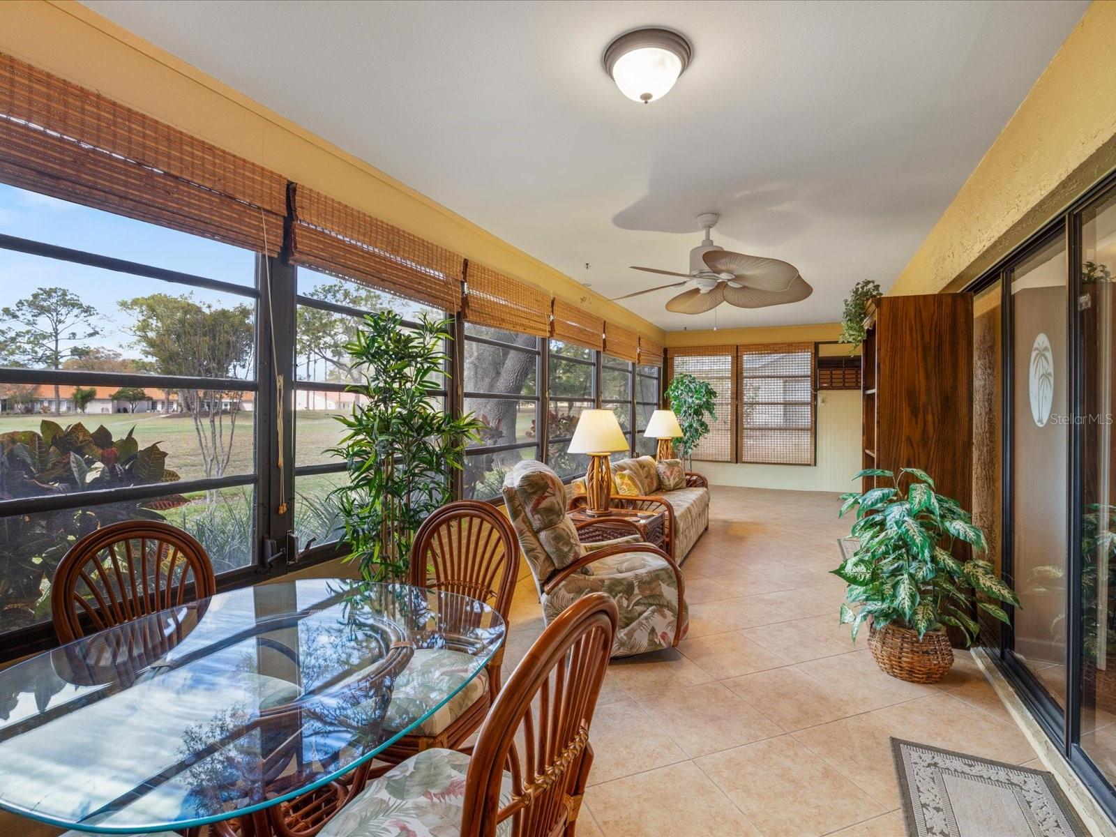 Expansive Florida room with beautiful viewsof the golf course