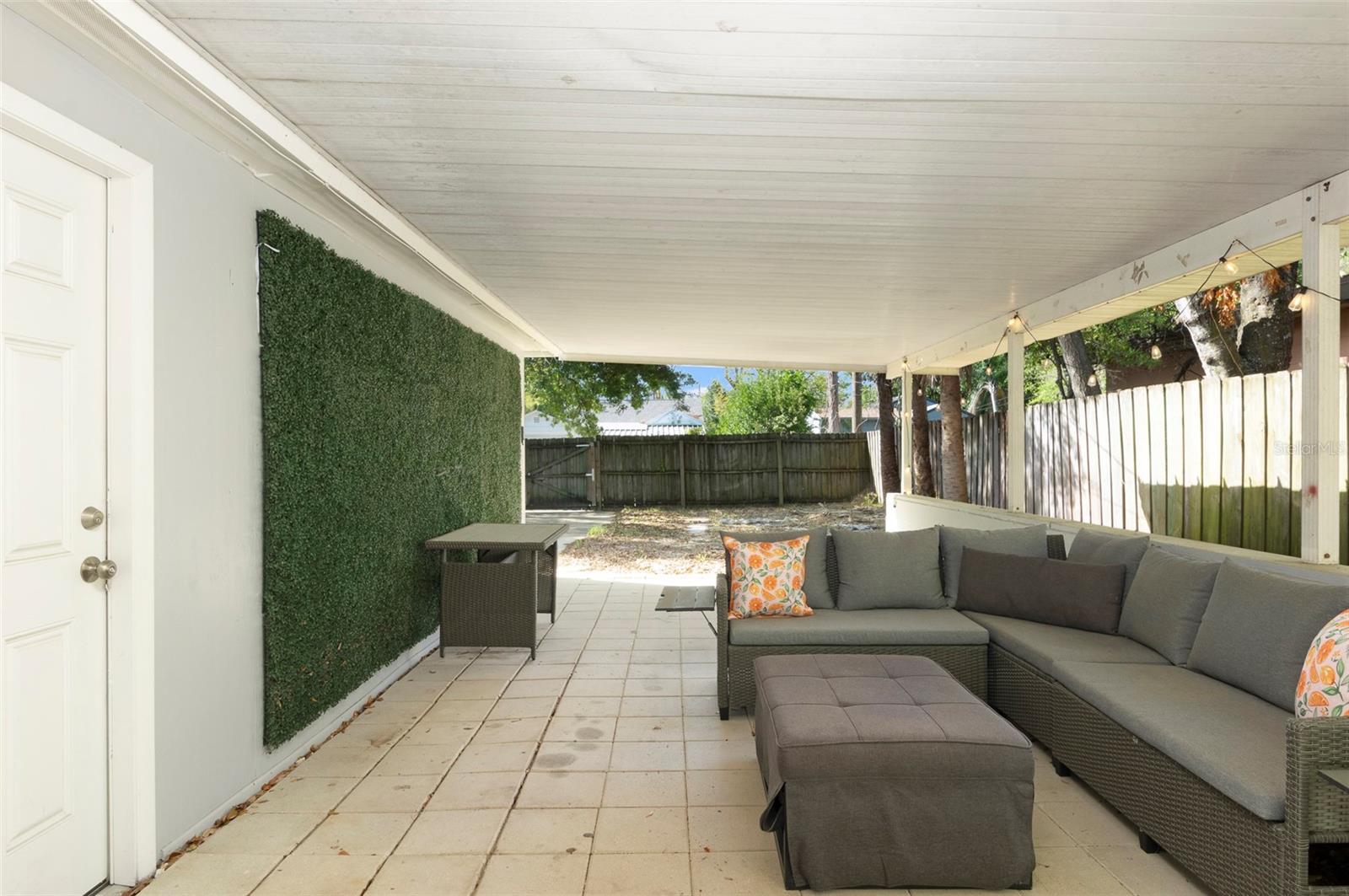 Oversized covered patio that can easily function as an outdoor entertaining area or carport for your toys
