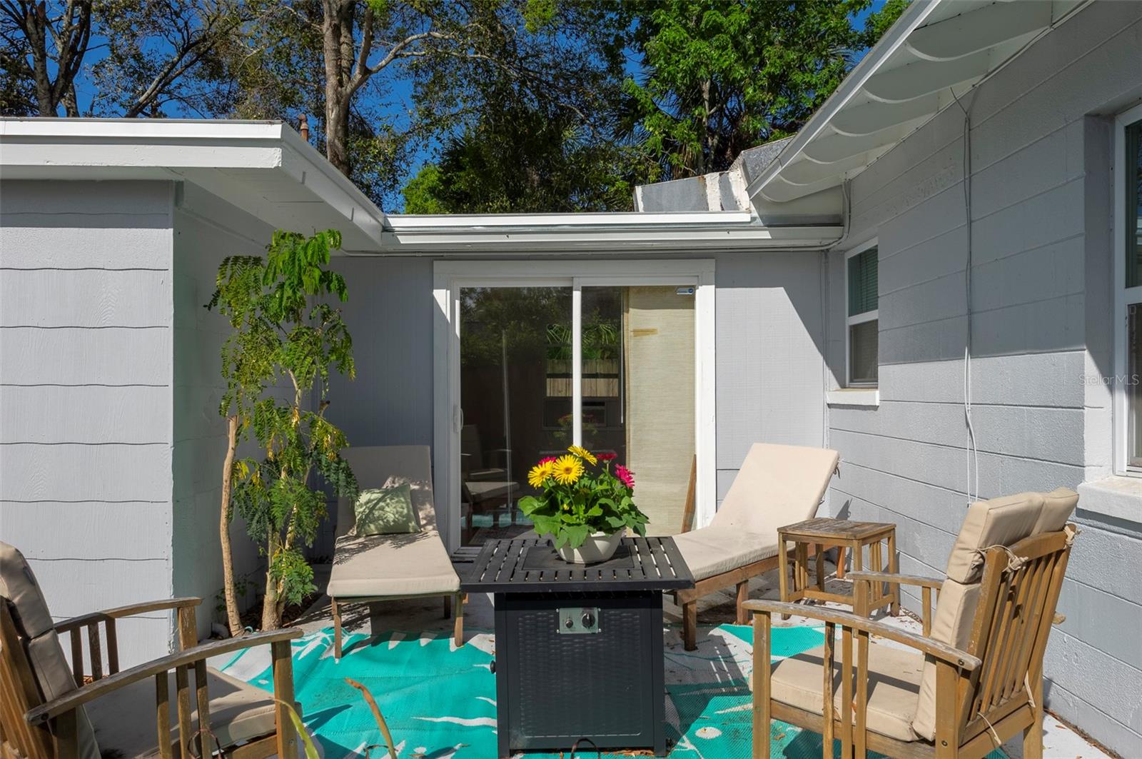 Side patio with a firepit