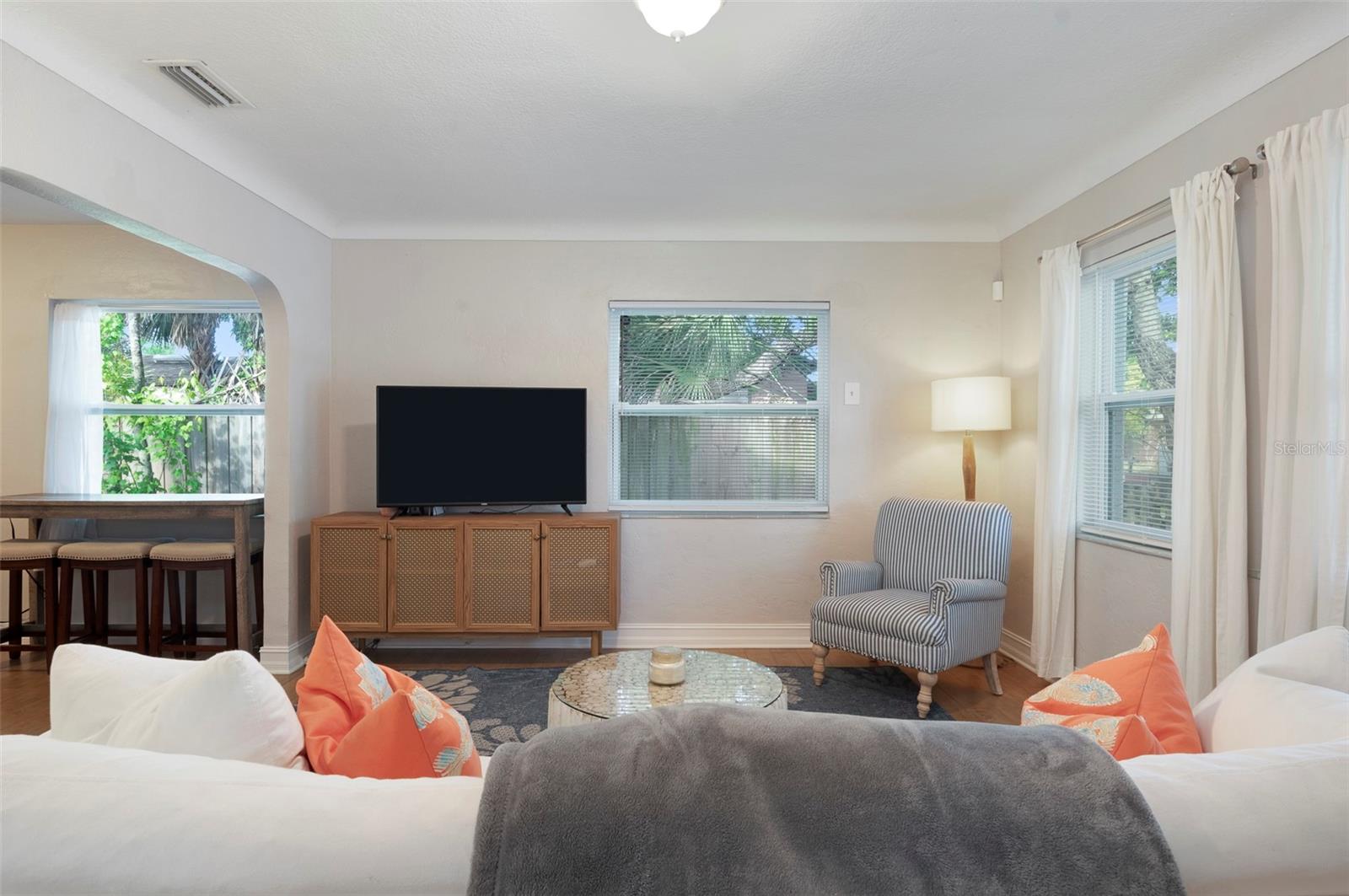 Beautifully furnished cozy living room flooded with natural light