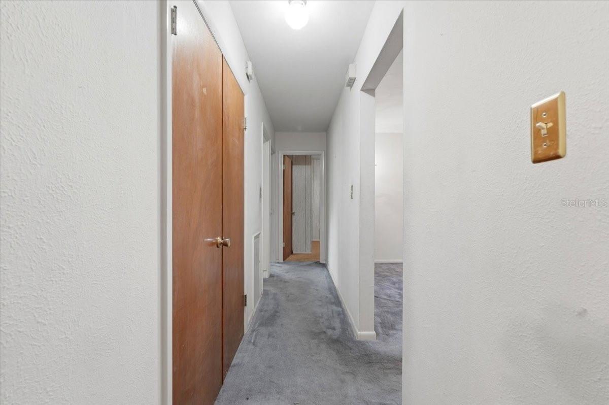 hallway flowing into bedroom & bathroom area