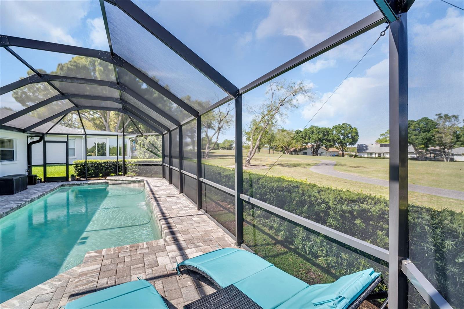 Two level paver patio to soak in the green view & pool waterfall for a relaxing ambiance~