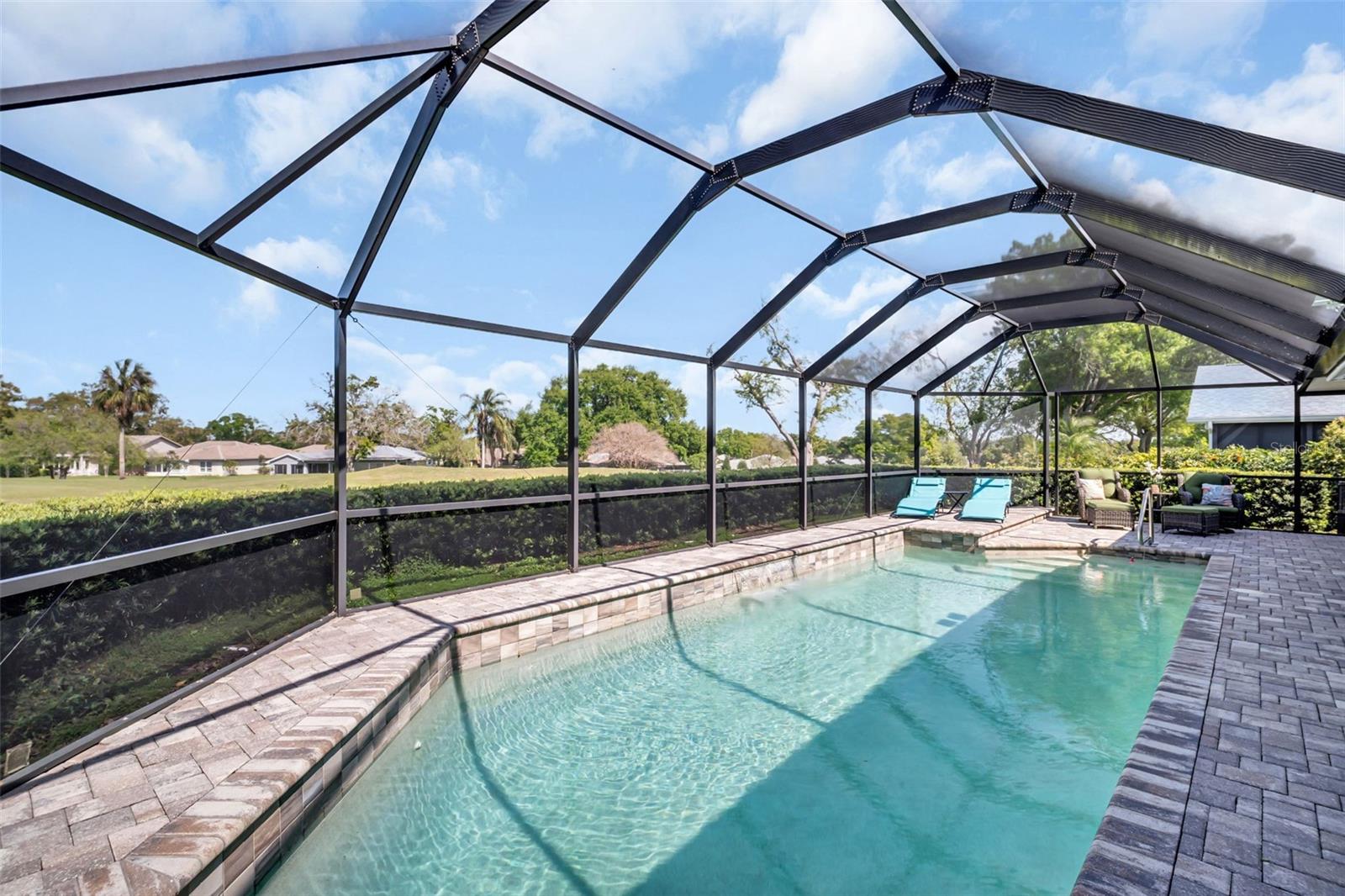 Entry steps at the shallow end and a bench at the deeper end~