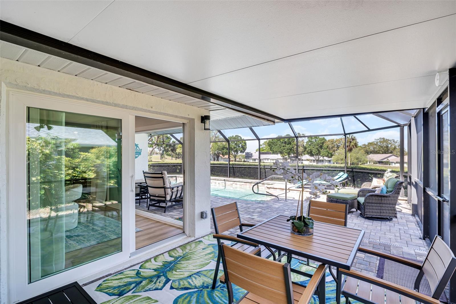 NEW hurricane-impact slider to covered pool patio~