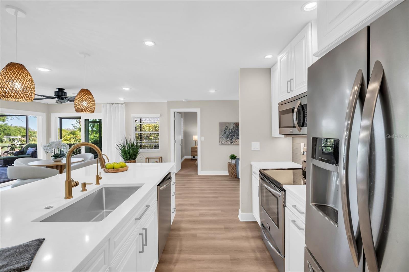 Deep sink, classy gold hardware, & sleek stainless appliances~