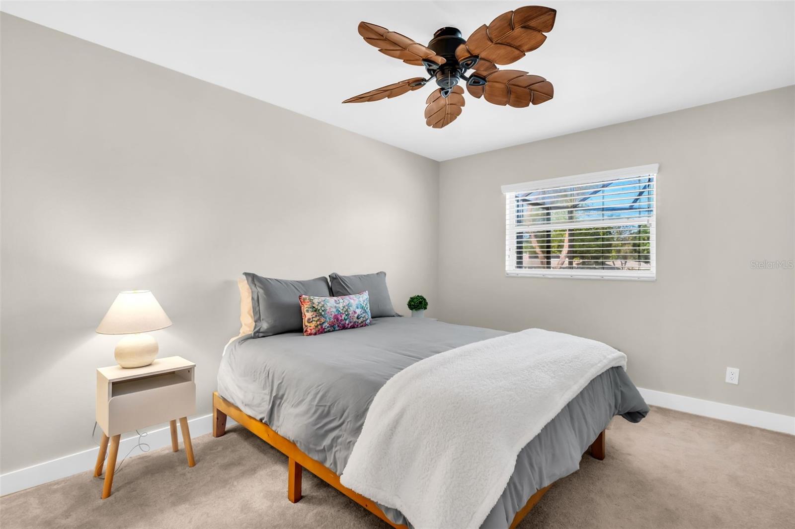 The 2nd bedroom perfectly split on the opposite side of the home plus pool and green views~