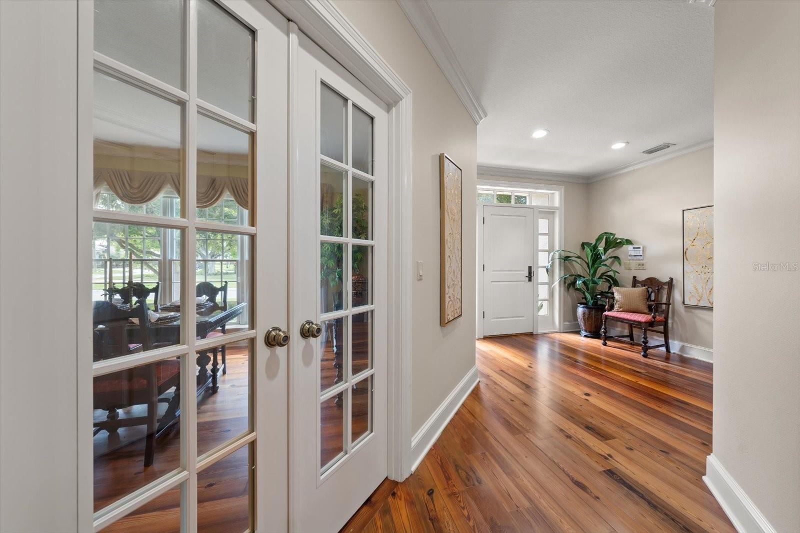 Entry to wine room through double French doors.