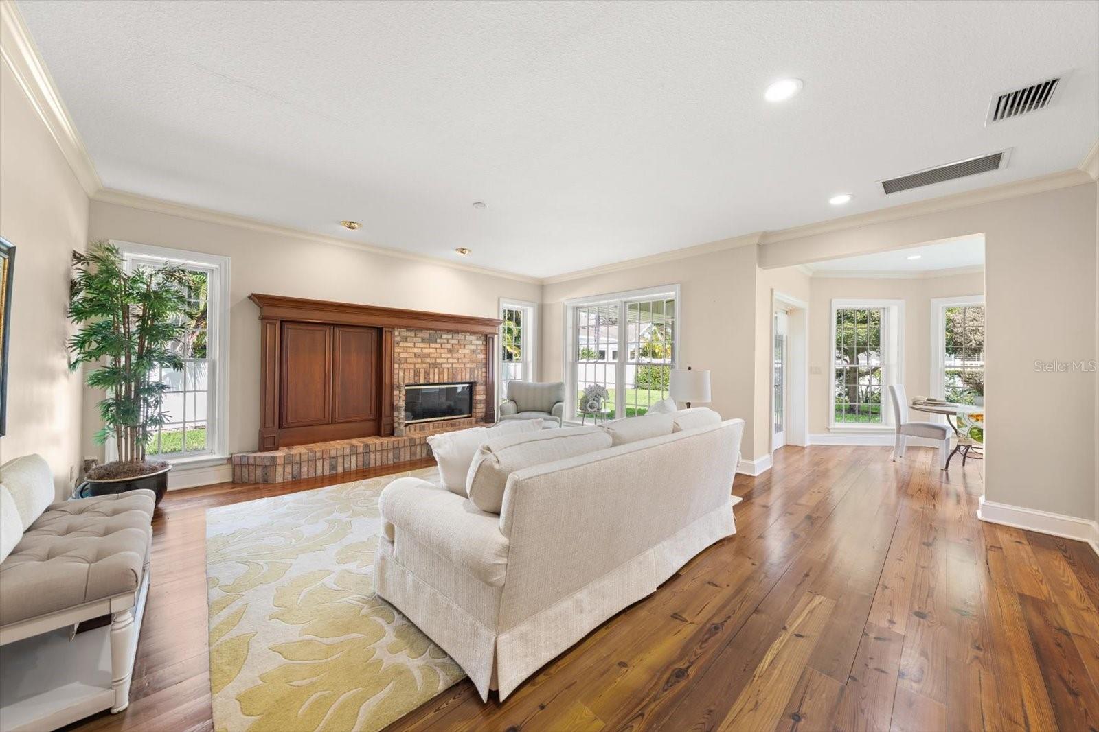 Anchored by a cozy fireplace, this space offers a relaxing atmosphere, all year!